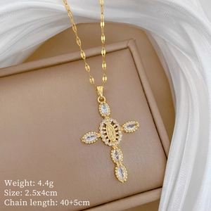 Detailed specs for gold cross pendant with cubic zirconia on elegant jewelry box