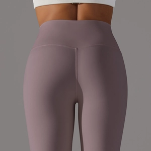 Detail of high waisted yoga leggings in matte purple-grey with push-up back seam design