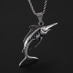 Macro shot of silver stainless steel swordfish pendant on a twisted rope chain