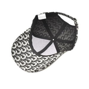 Internal view of a retro baseball cap with horse shoe print and black lining details