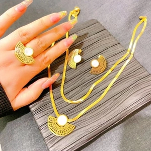 Exquisite gold扇-shaped jewelry set with white shell inlay, including necklace and ring
