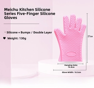 Macro detail of pink silicone oven mitt with heart-shaped anti-slip texture and dual-layer design
