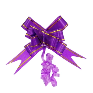 Purple gift bow with gold trim and ribbon details for festive packaging on white background