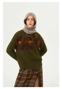 Detail of dark green knit sweater and grey speckled mohair balaclava hood texture