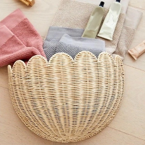 Detailed view of handmade woven wall basket with scallop lace edge for storage