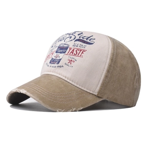 Detailed close-up of distressed brim and vintage industrial print on cotton baseball cap