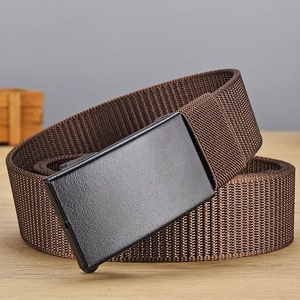 Close-up of brown nylon woven belt with black matte metal automatic buckle on wood
