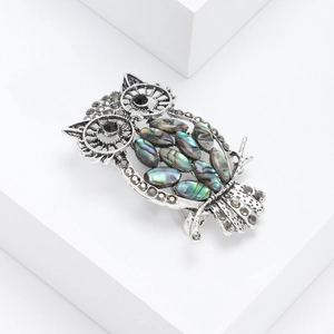 Vintage owl brooch with natural abalone shell and rhinestones on a geometric base