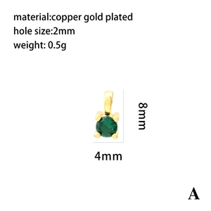 Macro detail of a small round green zircon pendant in 18K gold plated copper