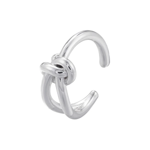Close-up of a silver knot-shaped ear cuff with a polished finish on white background