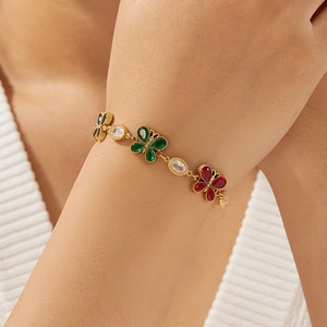Gold plated stainless steel bracelet with multi-color butterfly crystal stones and charms