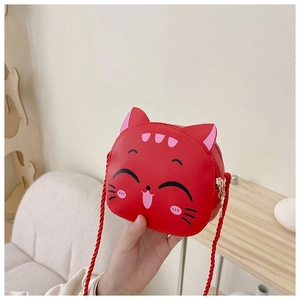 Detail view of the red cartoon cat shoulder bag with cute ears and zipper closure