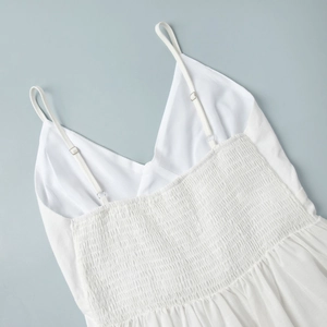 Detail view of cotton dress with smocking back and adjustable spaghetti straps