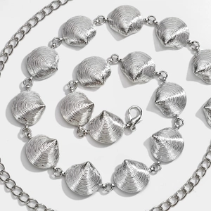 Silver shell-shaped metal waist chain belt with spiral texture and lobster clasp detail