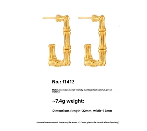 Detailed view of U-shaped bamboo texture earrings in 18K gold plated stainless steel