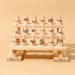 Bohemian ring set displayed on a three-tier solid wood tiered jewelry cone stand
