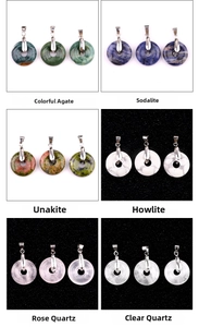 Macro detail of natural crystal donut pendants with polished silver metal bails