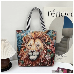 Detail of woven lion motif on canvas tote bag with textured jacquard embroidery