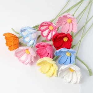 Handmade crochet flower bouquet with colorful knitted blossoms and long green stems