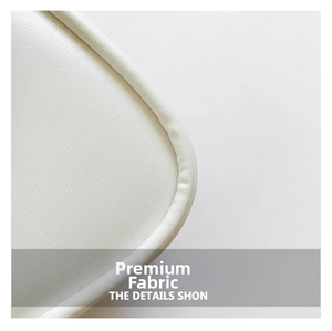 Detail showing premium white leather texture and round corner stitching on small bag