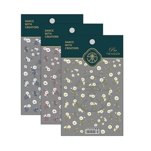 Floral nail art sticker set with blue, pink, and yellow flowers in minimalist style