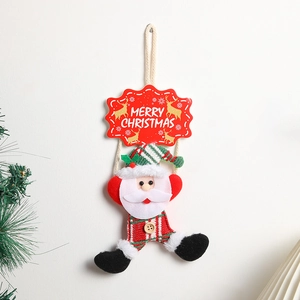 Plush Santa Claus Christmas door hanging decoration with Merry Christmas sign on white wall
