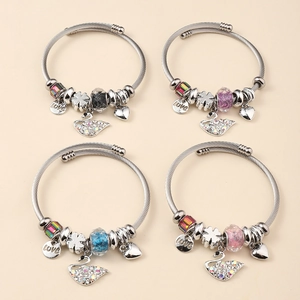 Detailed set of silver charm bracelets featuring swan and heart pendants with colorful beads