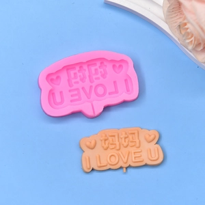 Detail of pink silicone mold with heart and Mom I Love U text for DIY Mother's Day crafts