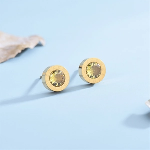 Gold Roman numeral stud earrings featuring a brilliant champagne crystal center