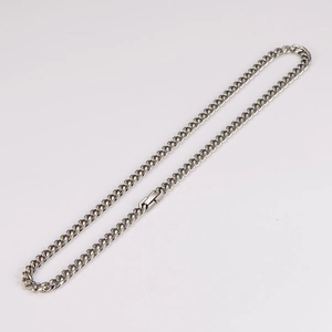 Detailed macro shot of 6mm silver stainless steel curb chain with push clasp