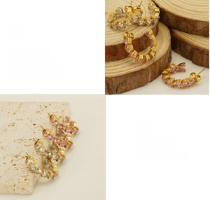 Detail of 18K gold plated U-shaped earrings with heart crystals and polished finish