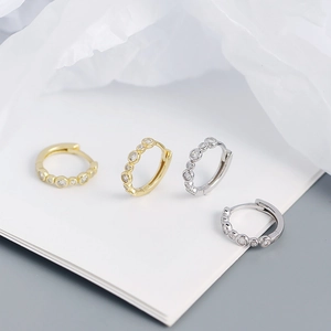 Set of gold and silver S925 sterling silver hoop earrings with inlaid clear zircons