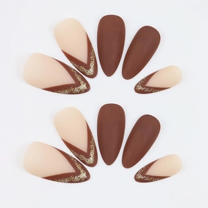 Brown matte almond press-on nails with deep V-cut French tips and gold glitter accents