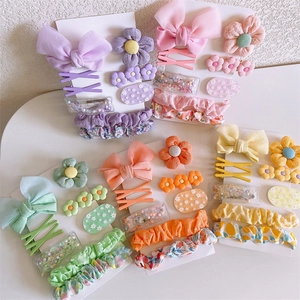 Kids hair accessory set with fabric bows, floral scrunchies and colorful clips