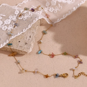 Detail of 18K gold plated stainless steel necklace with multi-color natural stones