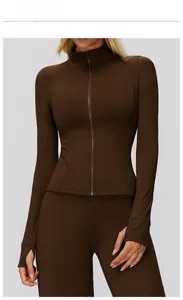 Detail view of coffee brown fitness jacket with thumbholes and ribbed elastic texture