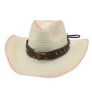 Western straw cowboy hat with pink gradient edges and a metallic bull skull ornament