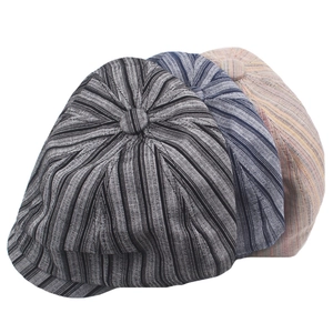 Three striped cotton linen newsboy caps in black blue and beige with retro texture