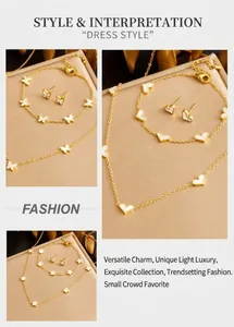 Detailed set of gold butterfly and clover jewelry with white mother of pearl inlay