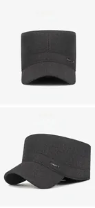 Detail view of winter grey military cap with sport metal badge and warm wool fabric