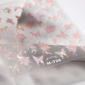 Holographic butterfly nail stickers M-726 with floral designs on transparent backing