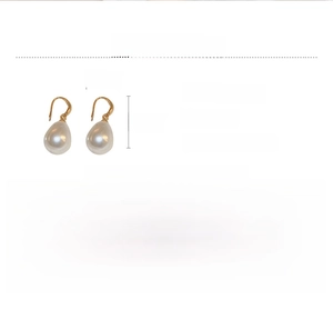 Macro detail showing waterdrop pearl earrings dimensions 3.6cm by 1.3cm with gold hooks