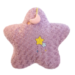 Purple star plush pillow with rose swirl texture and mini pink moon doll accessory