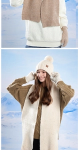 Detail of warm winter knit set featuring sequined beanie with pompom and thick scarf