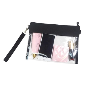 Clear PVC crossbody bag with black trim and wrist strap for stadium events