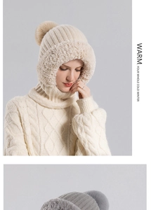 Détail d'une cagoule en tricot avec bordure en fausse fourrure et pompon pour l'hiver