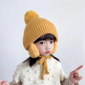 Kids winter knit trapper hat in bright yellow with earflaps and pom pom detail