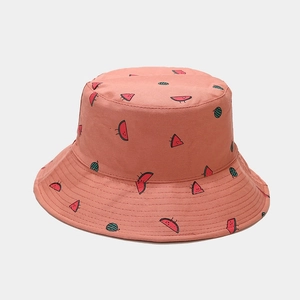 Close-up of pink bucket hat featuring cute cartoon watermelon embroidery and cotton fabric