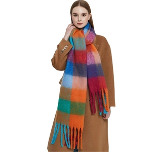 Thick colorful plaid mohair scarf with long tassels for women shown on a fashion model