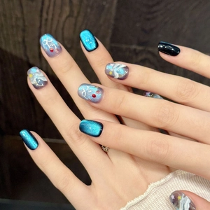 Blue cat eye press-on nails with ocean wave gradient and hand-painted starry sky patterns